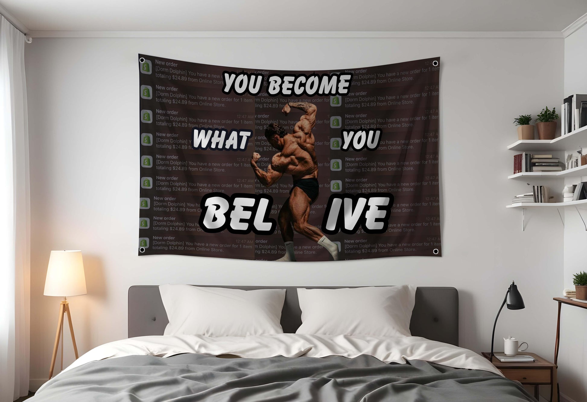 Inspirational Gym Flag that says "You Become what you believe" with Chris Bumstead flexing. In the background there are shopify sale notifications. Hung up in a dorm bedroom